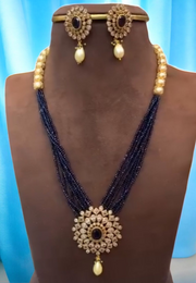 Turning multilayered purple beads short necklace with diamond look pendant